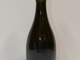 a bottle of wine that is sitting on a table