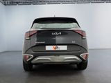 the rear end of a black car in a white room