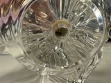 a glass vase that has a flower inside of it