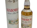 a bottle of whisky with a cardboard box next to it