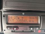 a digital clock on the dashboard of a car