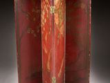 a red and gold screen with birds and flowers on it