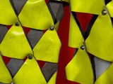 a close up of a yellow and black piece of clothing