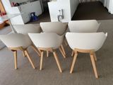 six chairs that are sitting in a row in a room