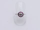 sterling silver ring with a purple and white stone center