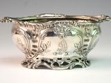 a silver bowl that is sitting on a table