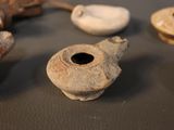 many different pieces of pottery sitting on a table