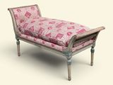 un banc rose et blanc sur lequel est posé un coussin rose