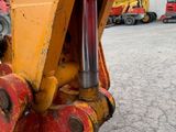 a close up view of a yellow dump truck ' s front end