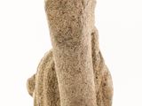 statue of a dog made of stone on a white background
