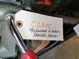 a label on a sewing machine with a pair of scissors