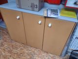 a cardboard box on top of a cabinet in a room