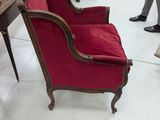 a red chair that is sitting in a room