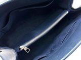 an image of a blue purse with a zipper