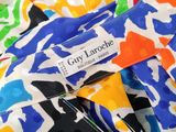 the label of a colorful shirt is displayed on a colorful shirt