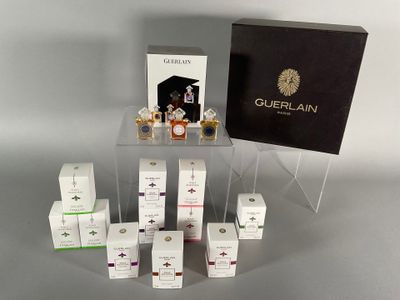 a display of perfume bottles and boxes on a table