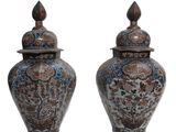 pair of asian style vases with lids on a white background