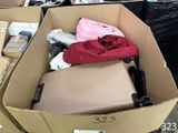 a cardboard box filled with luggage and other items