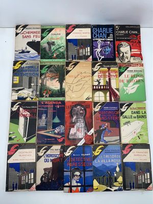 a lot of books that are stacked on top of each other