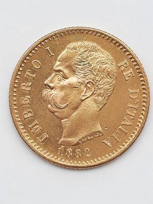 l'image d'une pièce d'or sur laquelle figure le visage d'un homme