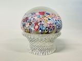 a small glass bowl with a colorful flower design on it