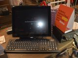 a laptop computer sitting on top of a wooden desk
