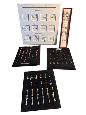 a display case with a variety of earrings in it
