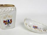 a small cup and a small bowl sitting next to each other