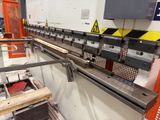 an image of a machine that is working on a piece of wood