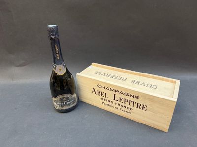 an image of a bottle of champagne next to a wooden box