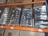 many stacks of boxes on a shelf in a warehouse