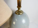 a lamp that is sitting on a table next to a lamp