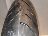 a close up view of a motorcycle tire on display