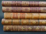 a stack of old books sitting on top of each other