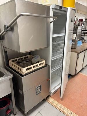 a commercial kitchen with stainless steel appliances and counter tops