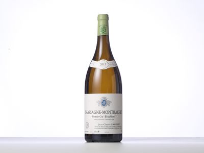 a bottle of white wine sitting on top of a table