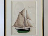 a picture of a sailboat in a frame on a shelf