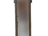 a tall mirror with a decorative design on the top of it