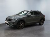 a grey volkswagen suv parked in a large room