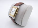 a close up of a watch on a display with a white background