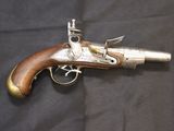 an old gun that is on display on a table