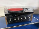 a record player that is sitting on top of a table