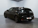 an image of a black car in a showroom