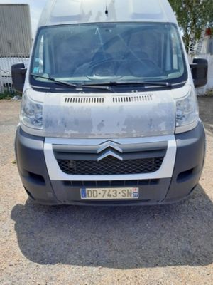 a white van that is parked in a parking lot