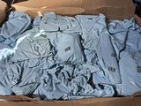 a cardboard box filled with a lot of clothes