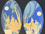 two oval paintings of people on a beach with palm trees and a full moon