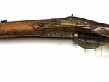 an image of a rifle that is on a white surface