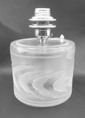 a black and white photo of a glass jar with a lid