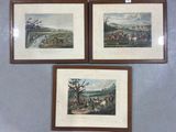 three framed prints of horses and riders on a wall in a room