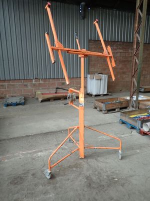 a crane that is sitting in a warehouse